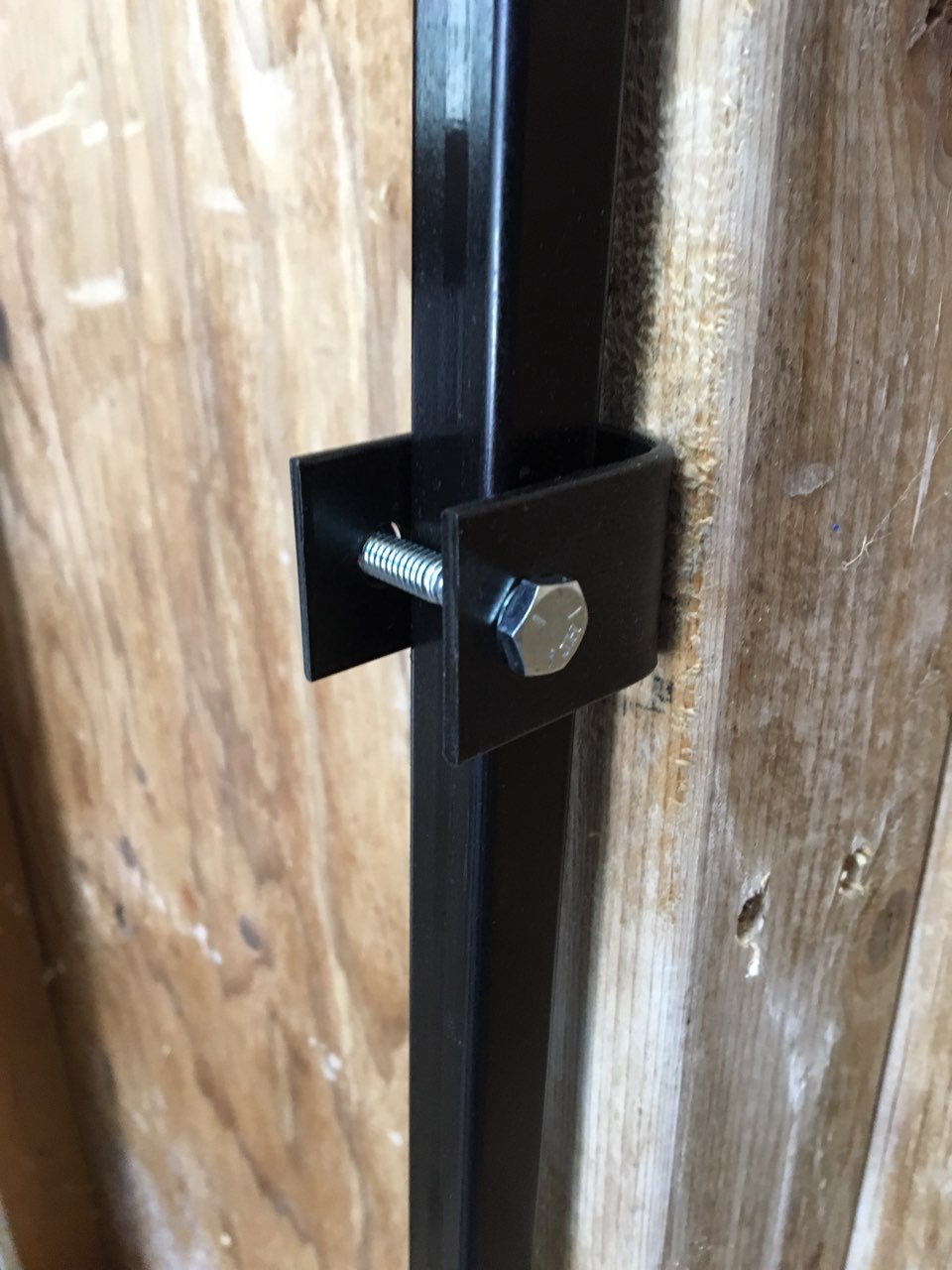 Goat pen wall bracket